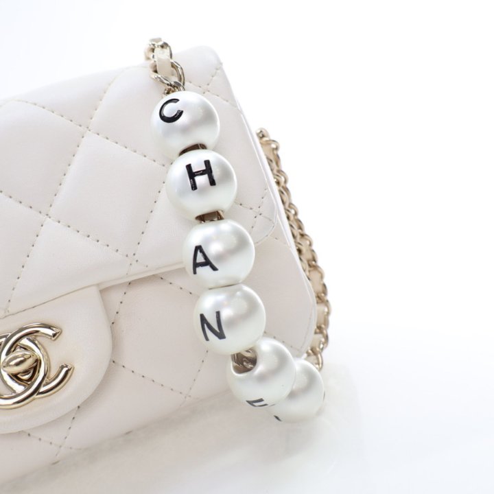 Chanel Mini White Lambskin Logo Pearl Chain Flap Bag Luxe Bag Rental